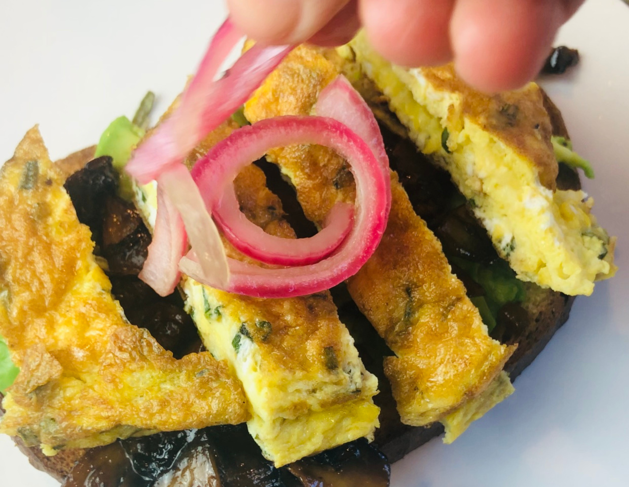 AVOCADO TOAST WITH CARAMELIZED MUSHROOMS AND SCRAMBLED EGGS